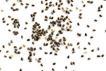 Superfood chia seeds, top view, isolated on white background. Healthy breakfast, vitamin snack, diet and healthy eating concept.