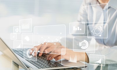 Woman Working with Laptop on blurred background, close-up