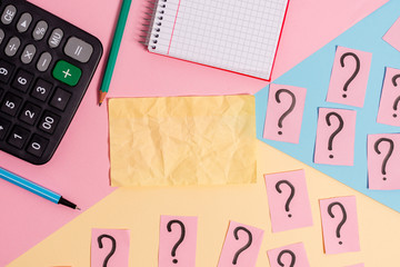 Mathematics stuff and writing equipment above pastel colours background