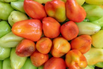 Bulgarian pepper is green and red in the basket