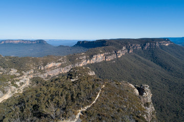 Mountain range and valley on a clear cloudless day in The Blue Mountains in New South Wales, Australia.