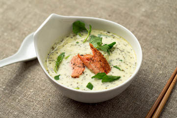 Creamy tom kha thai soup with salmon. One of the most popular Thai food, tom kha is a spicy and...