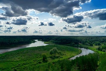 Fototapeta na wymiar Lithuanian summer landscape. View from Merkine fort hill to Nemunas river and Dzukija National Park in Lithuania