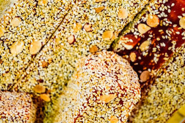 marmalade sticks with a nut, sprinkled with sesame. Indian sweets