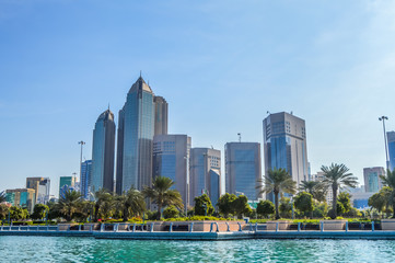 Fototapeta na wymiar Abu Dhabi city skyline along Corniche beach taken from a boat