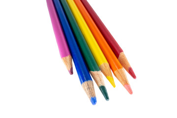 Rainbow colored pencils isolated against a white background - image