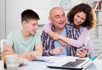 Happy family with papers