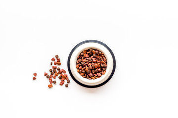 Dog dry food in bowl on white background top view mock-up