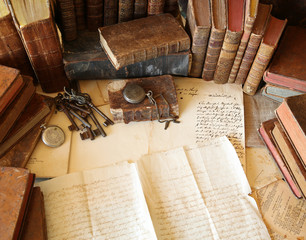 antique workspace with old books and handwriting