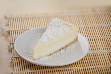delicious cheesecake with coconut on  plate