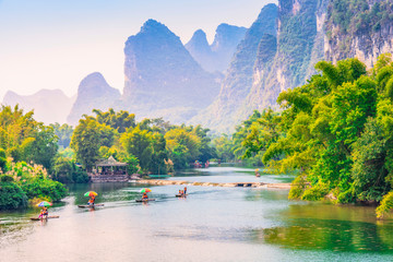 Landscape of Guilin. Tourists are visiting by Bamboo raft. Located in Yangshuo, Guilin, Guangxi, China.