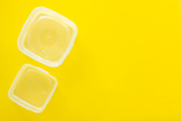 empty food container on yellow background top view mockup