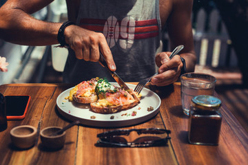 handsome beard man hair, brutal macho, dine in the restaurant, eating delicious served hot dish, Italian pasta, spices, fine dining, europe, food, Kef, lunch,breakfast and dinner in the cafe,smoothie
