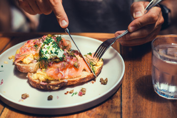 handsome beard man hair, brutal macho, dine in the restaurant, eating delicious served hot dish,...