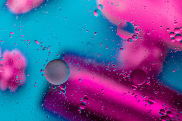Micro molecular abstract pattern of colored oil bubbles on water. 