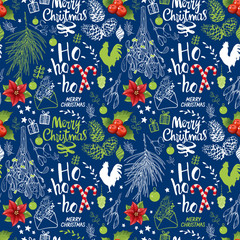 Seamless new year pattern on blue background. Christmas vector illustration set in sketch style. Beautiful funny symbols, illustration, mistletoe, pine branch and holiday lettering.