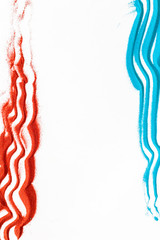 Modern red for blor with blue and red sand texture on white background top view space for text