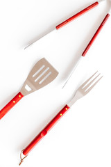 set of used barbecue tools on white background top view