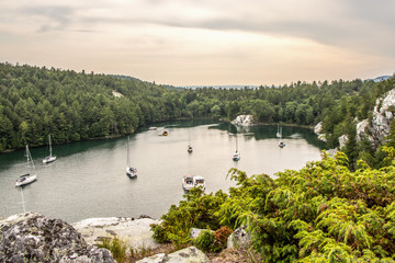 Fototapeta premium boats at anchor in Covered Portage, Killarney, Ontario, Canada