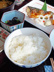 Japanese breakfast with rice, miso soup, grilled fish and seaweed