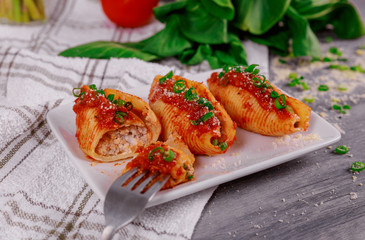 Jumbo shells pasta stuffed with a ricotta cheese and basil.