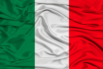 national flag of the country of Italy on gentle silk with wind folds, travel concept, immigration, politics, copy space, close-up