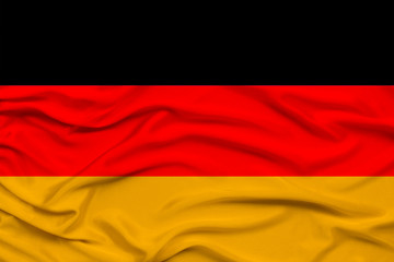 national flag of the country Germany on gentle silk with wind folds, travel concept, immigration, politics, copy space, close-up