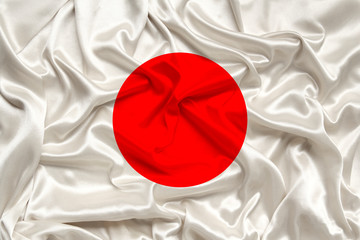 national flag of the country japan on gentle silk with wind folds, travel concept, immigration, politics, copy space, close-up