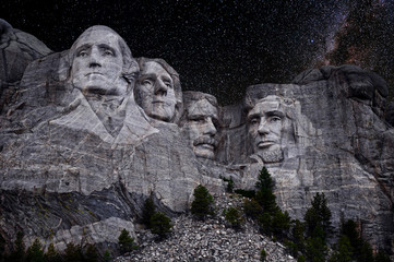 Mt. Rushmore National Memorial Park in South Dakota with stars and milky way background. Sculptures of former U.S. presidents; George Washington, Thomas Jefferson, Theodore Roosevelt,  Abraham Lincoln