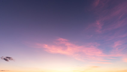 warm sunset sky pink clouds blue sky 