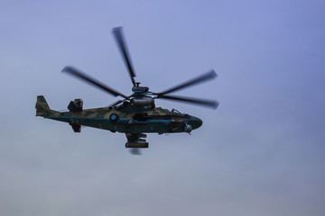 Fototapeta na wymiar Military helicopter in the sky.