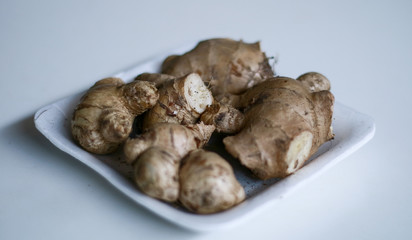 Ginger or Zingiber officinale on white background. Used as a spice and a folk medicine.
