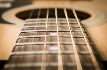 Fototapeta premium Close Up Fingerboard and Inlay of Acoustic Guitar in Vintage Tone