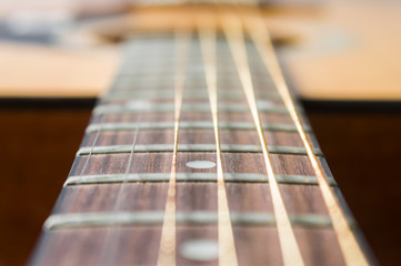 Fototapeta premium Fingerboard and Inlay of Wood Acoustic Guitar in Zoom View