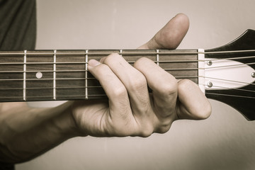Guitar Player Hand in C Major Chord on Acoustic Guitar in Front View in Vintage Tone