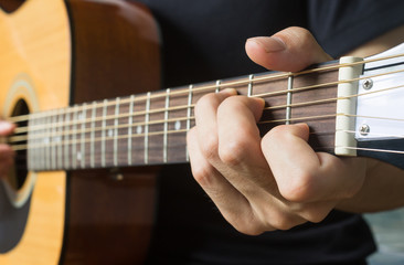 Obraz premium Guitar Player Hand in C Major Chord on Acoustic Guitar in Side View