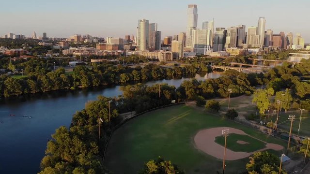 Aerial Drone shot of a Horizontal pan from a baseball field to downtown Austin, Tx.