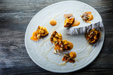 finely decorated modern restaurant dessert of cupcakes with sweet sauce