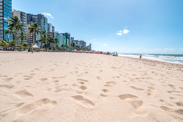 Recife, Boa Viagem Beach, Pernambuco, Brazil - June, 2019: Blue sky day at the beach early in the morning.