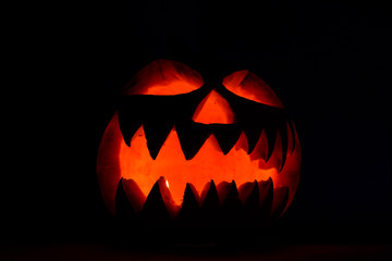 Spooky halloween pumpkin on a black background