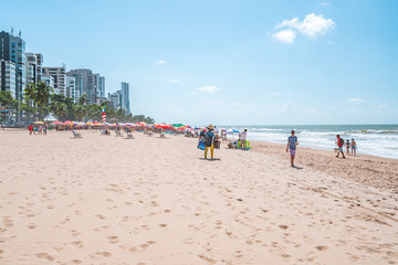 Recife, Boa Viagem Beach, Pernambuco, Brazil - June, 2019: Blue sky day at the beach early in the morning.