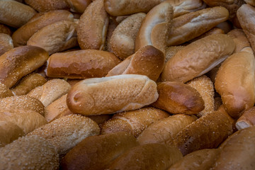 Rolls of bread stacked at a market