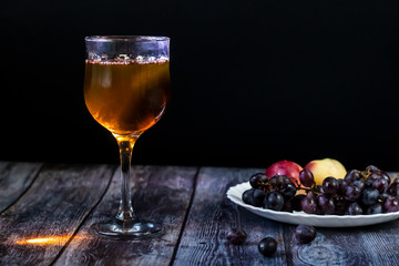 Amber wine. Wine in a glass. Traditional Georgian wine according to ancient technology. Close up
