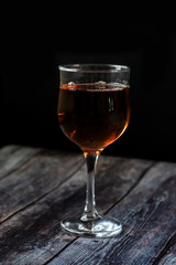 Amber wine. Wine in a glass. Traditional Georgian wine according to ancient technology. Close up