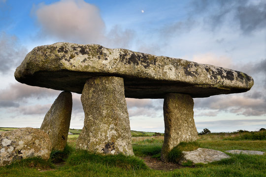 Lanyon Quoit dolmen neolithic tomb with three megalithic legs and 12 ton table capstone in Cornwall England at sunset