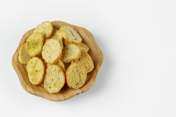 wood plate of crusty bread bruschetta on white background. top view