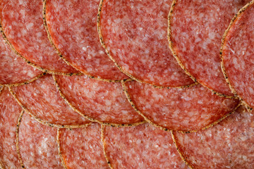 delicious sliced salami sausage . top view