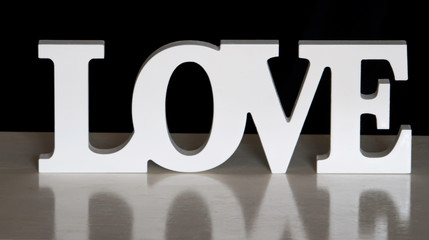 love word with reflection in black background - 285386957