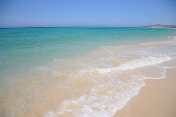 Fototapeta na wymiar blue sky, turquoise sea and sand