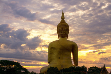 The golden Buddha statue during sunrise in Ang Thong Province Thailand